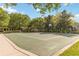 Community basketball court surrounded by mature trees and landscaping at 6799 Helmsley Cir, Windermere, FL 34786