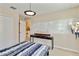 Bright bedroom with a unique model ship and whiteboard wall feature at 6799 Helmsley Cir, Windermere, FL 34786