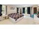 Inviting bedroom with a king-size bed, stylish furnishings, and ample natural light at 6799 Helmsley Cir, Windermere, FL 34786