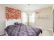 Bedroom featuring modern decor, a large window and neutral color scheme at 6799 Helmsley Cir, Windermere, FL 34786