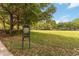 Community exercise area with instructions and grassy field at 6799 Helmsley Cir, Windermere, FL 34786