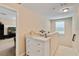 Bright upstairs hallway with a white dresser, toys and easy access to bedrooms at 6799 Helmsley Cir, Windermere, FL 34786