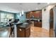 Open kitchen with stainless steel appliances, granite countertops, and an eat-in island at 6799 Helmsley Cir, Windermere, FL 34786