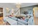 Bright living area with modern decor, hardwood floors, and a staircase leading to the upper level at 6799 Helmsley Cir, Windermere, FL 34786