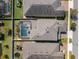 Overhead view of the house and back yard showing pool with screen enclosure and privacy fence at 7131 Desert Mandarin St, Winter Garden, FL 34787