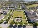 Birds eye view showing a well-manicured neighborhood park and playground area at 7131 Desert Mandarin St, Winter Garden, FL 34787