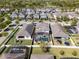 Areal shot of a residential neighborhood with similar homes, fenced yards, and a community pool at 7131 Desert Mandarin St, Winter Garden, FL 34787