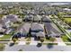 Aerial view of property showcasing home, landscaping, neighborhood, and nearby lake at 7131 Desert Mandarin St, Winter Garden, FL 34787