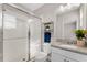 Bathroom with glass shower, toilet, and single sink vanity with granite countertop at 7131 Desert Mandarin St, Winter Garden, FL 34787