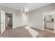 Neutral bedroom has plush carpets, natural lighting and ensuite bathroom at 7131 Desert Mandarin St, Winter Garden, FL 34787
