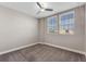 A bedroom with neutral walls, carpeted floor and natural light from two windows at 7131 Desert Mandarin St, Winter Garden, FL 34787