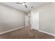 A carpeted bedroom with neutral walls and a ceiling fan at 7131 Desert Mandarin St, Winter Garden, FL 34787