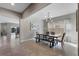 Bright dining room featuring tile floors, modern light fixture, and a contemporary dining table with bench seating at 7131 Desert Mandarin St, Winter Garden, FL 34787
