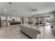 Spacious open-concept kitchen and living room with tile flooring, and sliding glass doors to the patio at 7131 Desert Mandarin St, Winter Garden, FL 34787