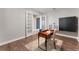 Cozy office space with hardwood floors, double doors, a stylish desk, and modern built in wall storage at 7131 Desert Mandarin St, Winter Garden, FL 34787