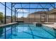 Large backyard pool and spa area, fully screened-in for privacy and enjoyment at 7131 Desert Mandarin St, Winter Garden, FL 34787