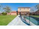 Beautiful fenced backyard with swimming pool and luscious lawn at 7355 Rush Ct, Orlando, FL 32818