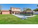 Beautiful fenced backyard with swimming pool and luscious lawn at 7355 Rush Ct, Orlando, FL 32818