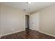 Cozy bedroom with wood-look flooring and neutral colored walls at 7355 Rush Ct, Orlando, FL 32818