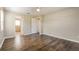 Spacious bedroom with wood floors, ceiling fan, and neutral paint scheme at 7355 Rush Ct, Orlando, FL 32818
