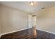 Bedroom with wood-look flooring and neutral colored walls at 7355 Rush Ct, Orlando, FL 32818