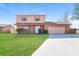 Charming two-story home featuring a well-manicured lawn and a two-car garage at 7355 Rush Ct, Orlando, FL 32818
