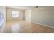 Spacious living room features tile flooring, neutral walls, and large windows for natural light at 7355 Rush Ct, Orlando, FL 32818
