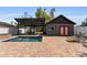 Backyard featuring a pool, cabana, and brick patio, perfect for outdoor entertaining at 833 N Thornton Ave, Orlando, FL 32803