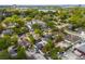 An aerial view of the street and surrounding neighborhood and a clear lake at 833 N Thornton Ave, Orlando, FL 32803