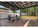 Backyard area with brick-paved patio and pergola, furnished for relaxing and entertaining at 833 N Thornton Ave, Orlando, FL 32803