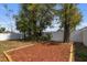 Backyard with mulched play area and perimeter fence creating a private space at 833 N Thornton Ave, Orlando, FL 32803