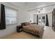 Spacious bedroom with wood floors and French doors to the outdoor pool area at 833 N Thornton Ave, Orlando, FL 32803
