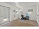 Versatile bonus room features a refrigerator, natural light, and door leading outside at 833 N Thornton Ave, Orlando, FL 32803