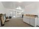 Multi-purpose room has double doors that lead outside, carpet and cabinetry for flexible uses at 833 N Thornton Ave, Orlando, FL 32803