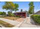 Charming home featuring red trim, green grass, and a walkway leading to the front door at 833 N Thornton Ave, Orlando, FL 32803