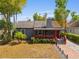 Charming single Gathering home with a landscaped front yard and red painted porch trim at 833 N Thornton Ave, Orlando, FL 32803