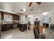 Bright eat-in kitchen with stainless appliances, dark wood cabinets, and center island at 833 N Thornton Ave, Orlando, FL 32803
