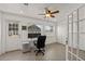 Bright office space with tiled floor, equipped with a ceiling fan and work space near window at 833 N Thornton Ave, Orlando, FL 32803