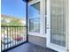 Cozy balcony with black metal railing offering outdoor space to relax and enjoy the views at 869 Taramundi Dr, Oviedo, FL 32765