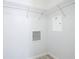 White walk-in closet provides efficient organization with wire shelving and vent at 869 Taramundi Dr, Oviedo, FL 32765