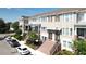 Inviting townhomes feature tidy landscaping, brick stairs, and neutral exteriors in a desirable neighborhood at 869 Taramundi Dr, Oviedo, FL 32765