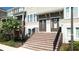 Charming townhome entrances with brick stairs and tidy landscaping create curb appeal in this community at 869 Taramundi Dr, Oviedo, FL 32765