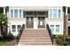 Brick stairs and well-kept landscaping leading to inviting townhome entrances with neutral exteriors at 869 Taramundi Dr, Oviedo, FL 32765