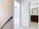 Hallway offering a view of the bedroom and bathroom with modern vinyl flooring at 869 Taramundi Dr, Oviedo, FL 32765