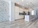 Modern kitchen with a kitchen island, stainless appliances, and granite countertops at 869 Taramundi Dr, Oviedo, FL 32765