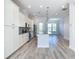 Modern kitchen with stainless steel appliances, granite countertops, and a center island at 869 Taramundi Dr, Oviedo, FL 32765