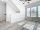 Open-concept living room with lots of natural light and modern gray flooring at 869 Taramundi Dr, Oviedo, FL 32765