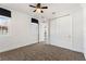 Bright bedroom with patterned carpet, large closet and exterior view at 8872 Bismarck Palm Dr, Winter Garden, FL 34787