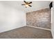 Bedroom with patterned carpet and a decorative brick accent wall at 8872 Bismarck Palm Dr, Winter Garden, FL 34787