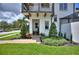 Charming home featuring a beautifully landscaped front yard and inviting entrance with lovely decor at 8872 Bismarck Palm Dr, Winter Garden, FL 34787